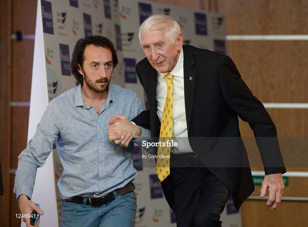 30 November 2016; Ronnie Delany is escorted on stage by Feidhlim Kelly, Athletics Ireland, during the Irish Life Health National Athletics Awards 2016 at the Crowne Plaza Hotel in Santry, Dublin. Photo by Cody Glenn/Sportsfile