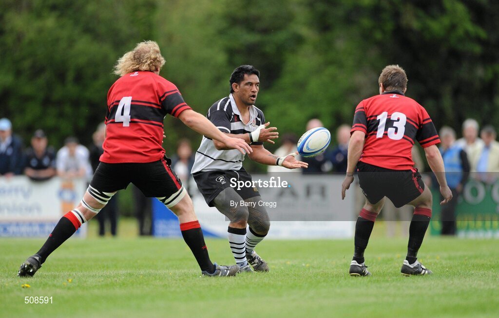24 April 2011; Eneliko Fa'atau, Dundalk RFC, in action against Dave Hanlon, left, and Keith Scally, Tullamore RFC. Newstalk Provincial Towns Cup Final, Dundalk RFC v Tullamore RFC, Edenderry RFC, Coolavacoose, Carbury, Co. Kildare. Picture credit: Barry Cregg / SPORTSFILE