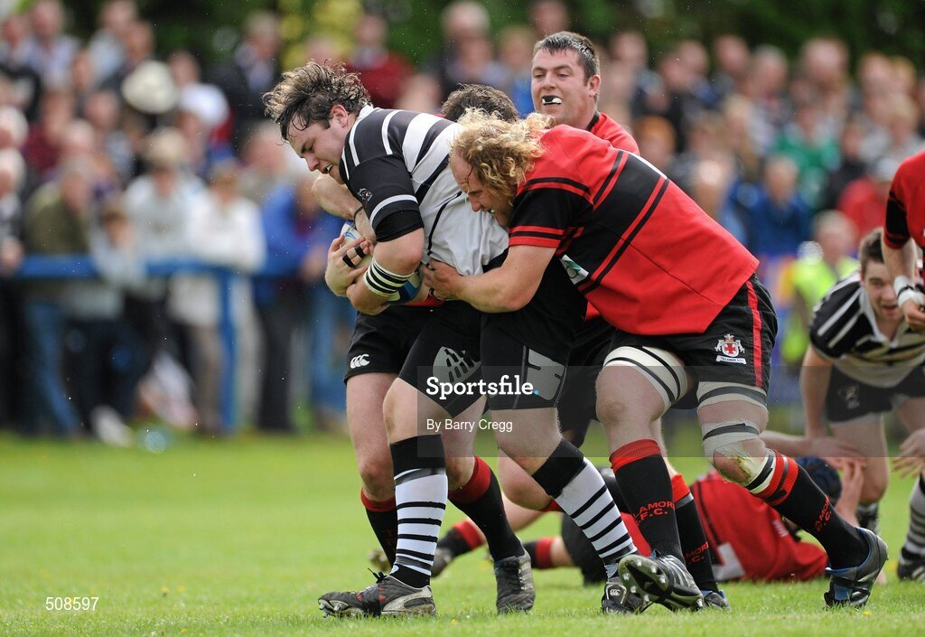 24 April 2011; Ronan Donnelly, Dundalk RFC, is tackled by Ivor Scully, left, and Dave Hanlon, right, Tullamore RFC. Newstalk Provincial Towns Cup Final, Dundalk RFC v Tullamore RFC, Edenderry RFC, Coolavacoose, Carbury, Co. Kildare. Picture credit: Barry Cregg / SPORTSFILE