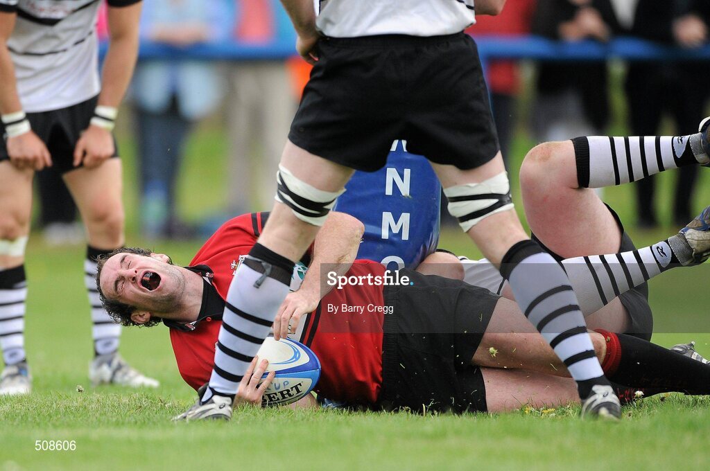 24 April 2011; Ivor Scully, Tullamore RFC, injures himself after scoring his side's second try, despite the tackle of Cillian McDonald, Dundalk RFC. Newstalk Provincial Towns Cup Final, Dundalk RFC v Tullamore RFC, Edenderry RFC, Coolavacoose, Carbury, Co. Kildare. Picture credit: Barry Cregg / SPORTSFILE