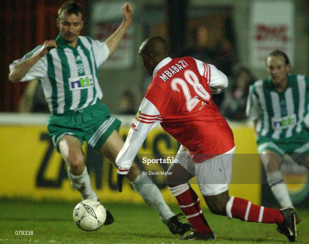 14 December 2001; Charles Mbabazi Livingstone of St Patrick's Athletic in action against Mick Doohan of Bray Wanderers during the FAI Carlsberg Cup Second Round match between St Patrick's Athletic and Bray Wanderers at Richmond Park in Dublin. Photo by David Maher/Sportsfile