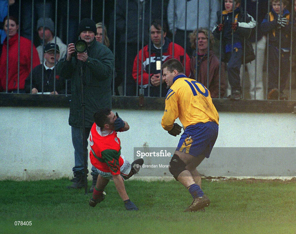 16 December 2001; Barry Mernagh of Rathnew falls to the ground holding his face after a clash with Dessie Farrell of Na Fianna, which resulted in Farrell being sent off by referee Mick Monahan, during the AIB Leinster Senior Club Football Championship Final match between Na Fianna and Rathnew at St Conleth's Park in Newbridge, Kildare. Photo by Brendan Moran/Sportsfile