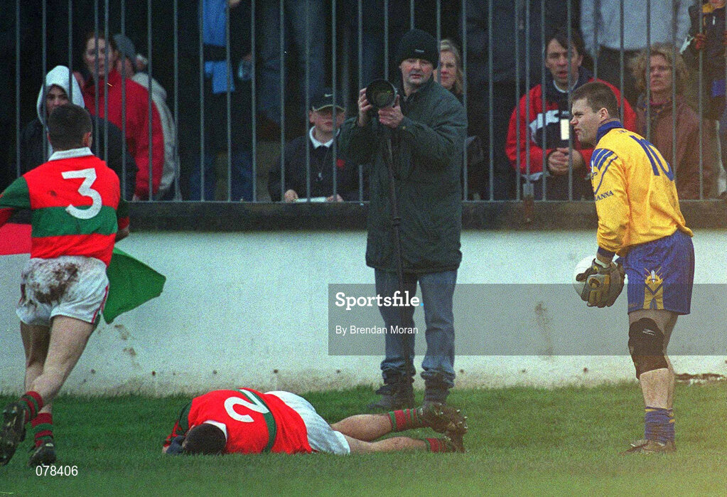 16 December 2001; Barry Mernagh of Rathnew lies injured after a clash with Na Fianna's Dessie Farrell, right, which resulted in Farrell being sent off by referee Mick Monahan during the AIB Leinster Senior Club Football Championship Final match between Na Fianna and Rathnew at St Conleth's Park in Newbridge, Kildare. Photo by Brendan Moran/Sportsfile