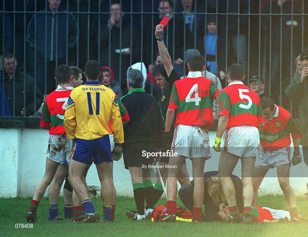 16 December 2001; Referee Mick Monahan issues a red card to Dessie Farrell  of Na Fianna after a clash with Barry Mernagh of Rathnew, on the ground, during the AIB Leinster Senior Club Football Championship Final match between Na Fianna and Rathnew at St Conleth's Park in Newbridge, Kildare. Photo by Brendan Moran/Sportsfile