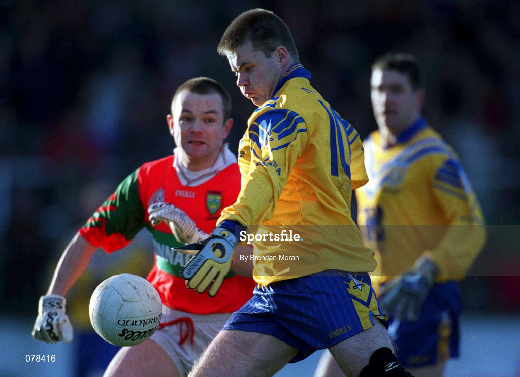16 December 2001; Dessie Farrell of Na Fianna scores his side's first goal despite the attentions of Mark Coffey of Rathnew during the AIB Leinster Senior Club Football Championship Final match between Na Fianna and Rathnew at St Conleth's Park in Newbridge, Kildare. Photo by Brendan Moran/Sportsfile