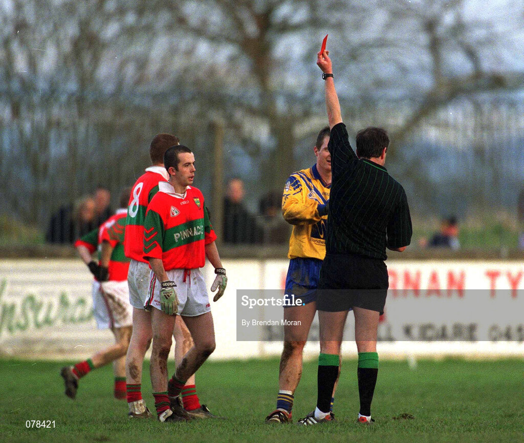 16 December 2001; Des Macken of Na Fianna is issued with a red card by referee Mick Monahan during the AIB Leinster Senior Club Football Championship Final match between Na Fianna and Rathnew at St Conleth's Park in Newbridge, Kildare. Photo by Brendan Moran/Sportsfile