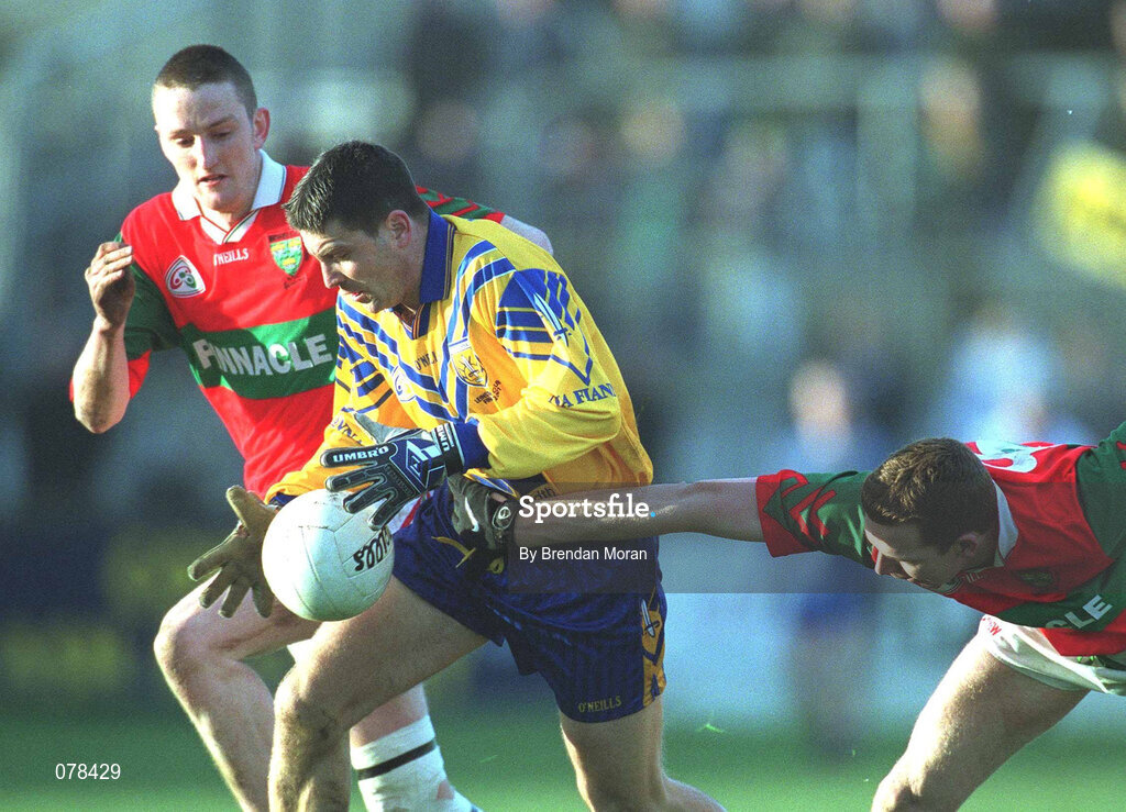 16 December 2001; Senan Connell of Na Fianna is tackled by Darren Coffey, right, and Richard Dignam of Rathnew during the AIB Leinster Senior Club Football Championship Final match between Na Fianna and Rathnew at St Conleth's Park in Newbridge, Kildare. Photo by Brendan Moran/Sportsfile