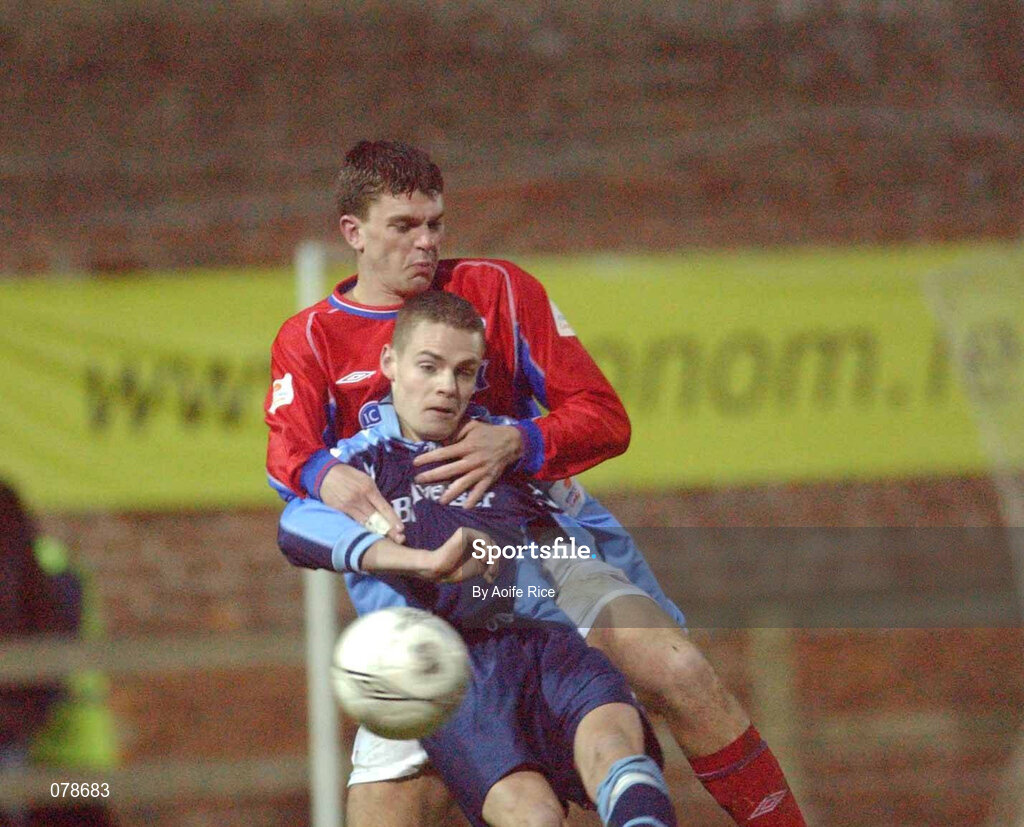 23 December 2001; Robert Martin of UCD in action against Kevin Doherty of Shelbourne during the eircom League Premier Division match between UCD and Shelbourne at Belfield Park in Dublin. Photo by  Aoife Rice/Sportsfile