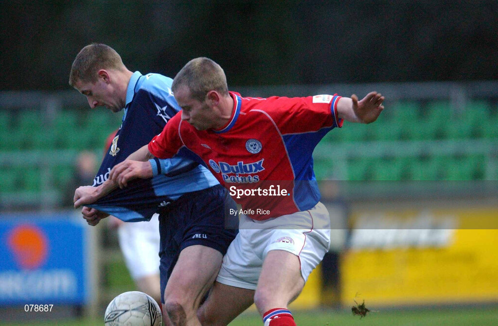 23 December 2001; Daragh Ryan of UCD is tackled by Jim Crawford of Shelbourne during the eircom League Premier Division match between UCD and Shelbourne at Belfield Park in Dublin. Photo by  Aoife Rice/Sportsfile