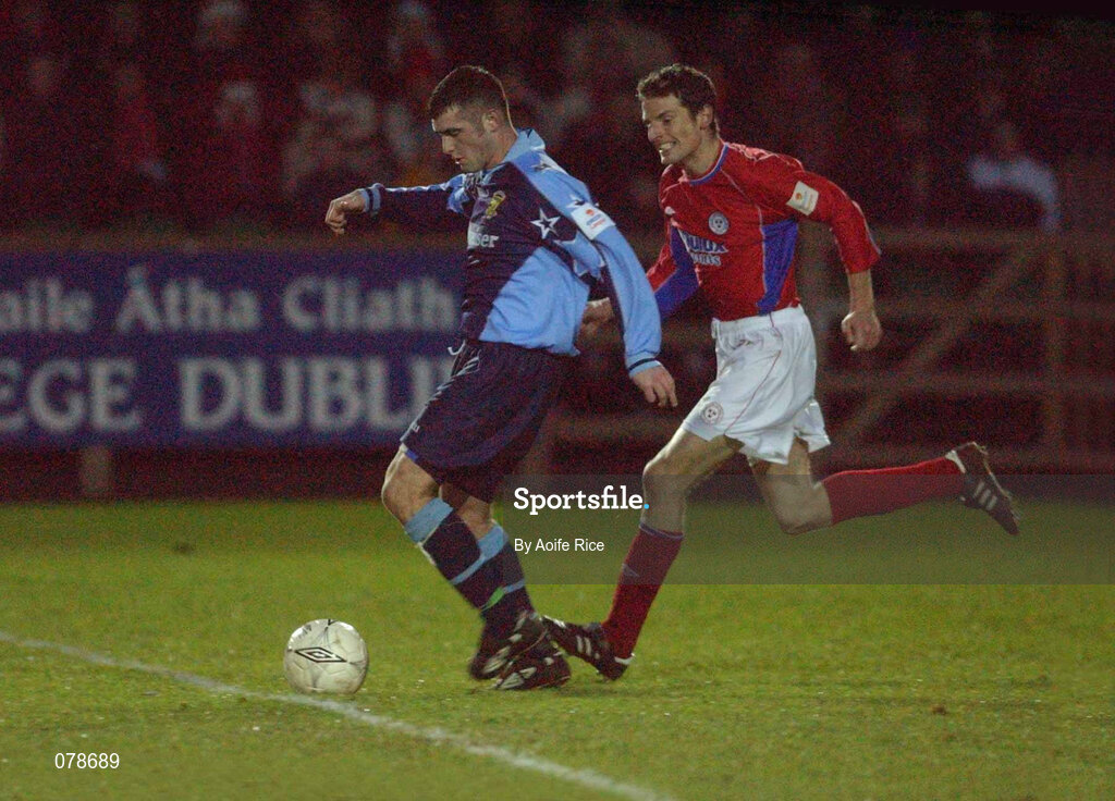 23 December 2001; Robert Martin of UCD in action against Jim Crawford of Shelbourne during the eircom League Premier Division match between UCD and Shelbourne at Belfield Park in Dublin. Photo by  Aoife Rice/Sportsfile