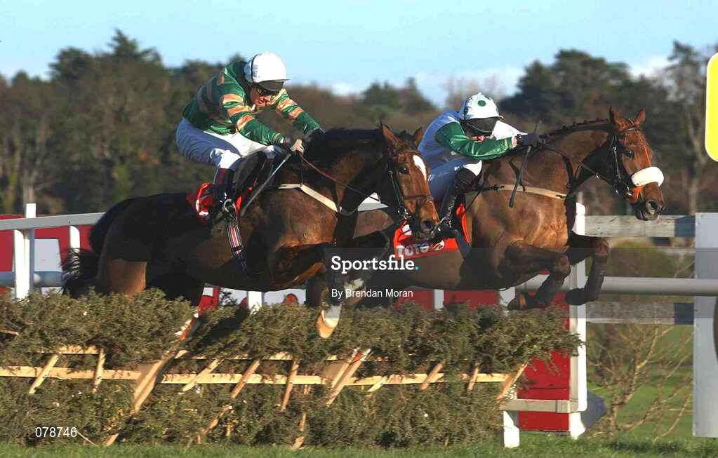 29 December 2001; Istabraq, with Charlie Swan up, left, jumps the last alongside Bust Out, with Barry Geraghty up, on their way to winning the on Day Four of the Leopardstown Christmas Festival at Leopardstown Racecourse in Dublin. Photo by Brendan Moran/Sportsfile