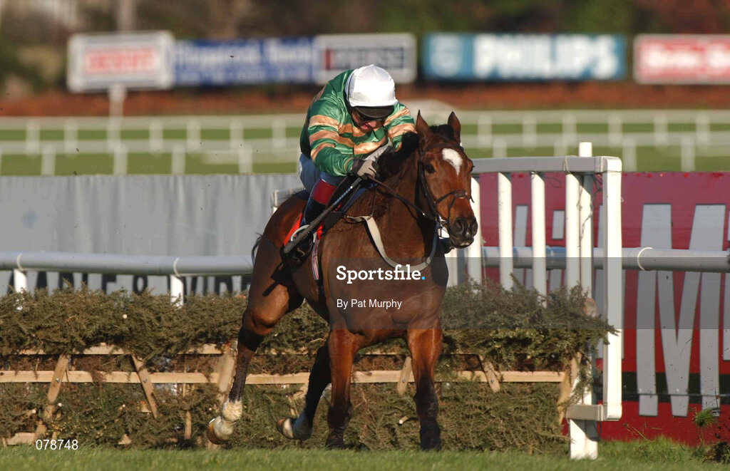 29 December 2001; Istabraq, with Charlie Swan up, jumps the last on their way to winning the Tote December Festival Hurdle on Day Four of the Leopardstown Christmas Festival at Leopardstown Racecourse in Dublin. Photo by Pat Murphy/Sportsfile