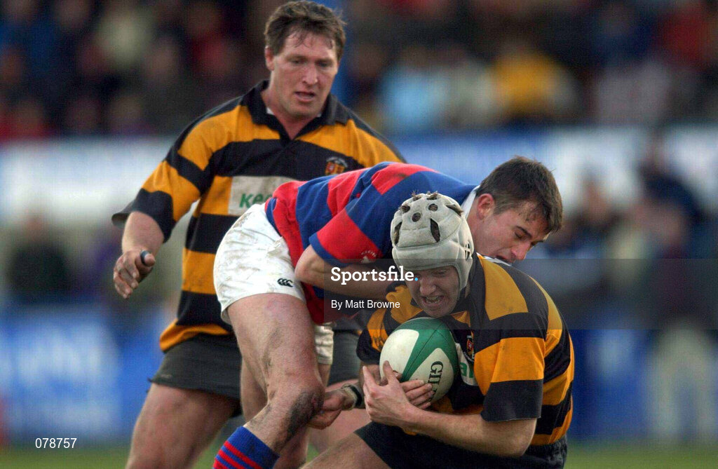 29 December 2001; Billy Murphy of County Carlow is tackled by Alan Reddan of Clontarf during the Leinster Senior Cup Final match between Clontarf and County Carlow at Donnybrook Stadium in Dublin. Photo by Matt Browne/Sportsfile