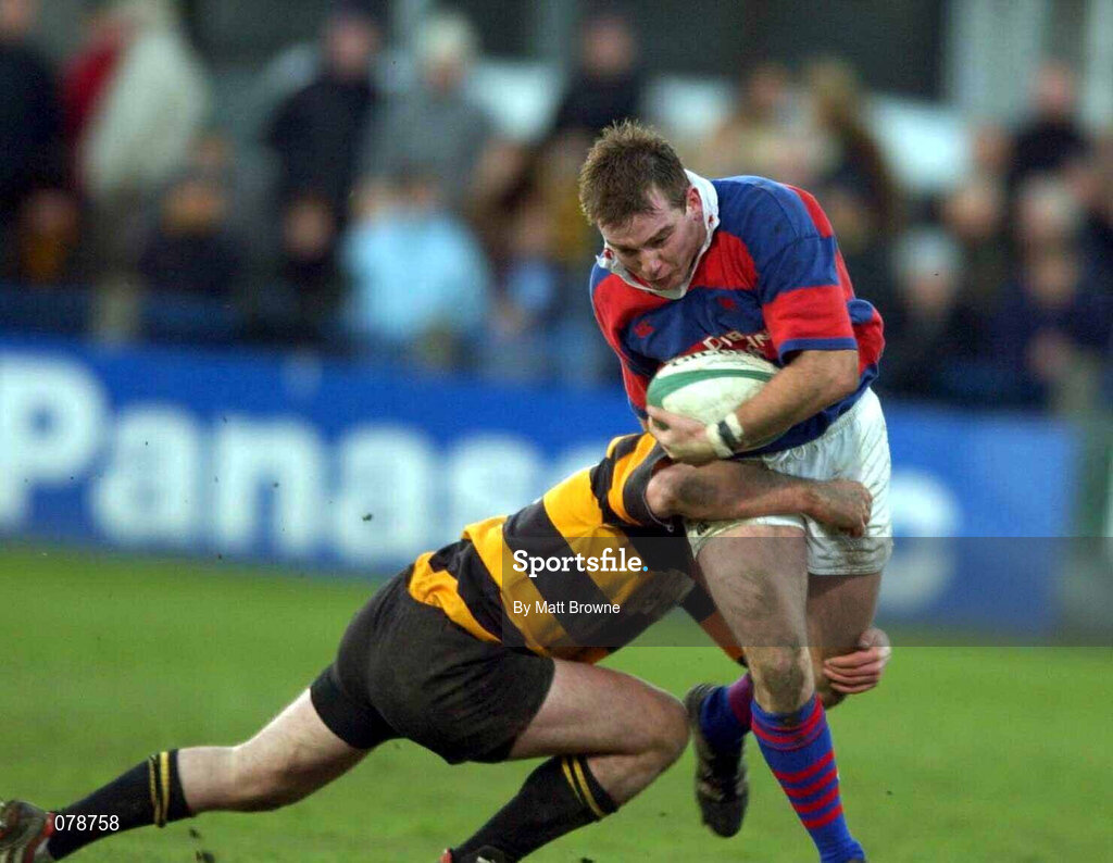 29 December 2001; Dave O'Brien of Clontarf is tackled by Robert Byrne of County Carlow during the Leinster Senior Cup Final match between Clontarf and County Carlow at Donnybrook Stadium in Dublin. Photo by Matt Browne/Sportsfile