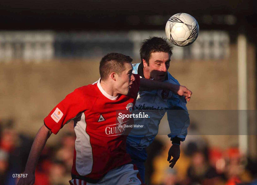 30 December 2001; Darren Kelly of Derry City in action against Noel Hartigan of Cork City during the eircom League Premier Division match between Cork City and Derry City at Turners Cross in Dublin. Photo by David Maher/Sportsfile