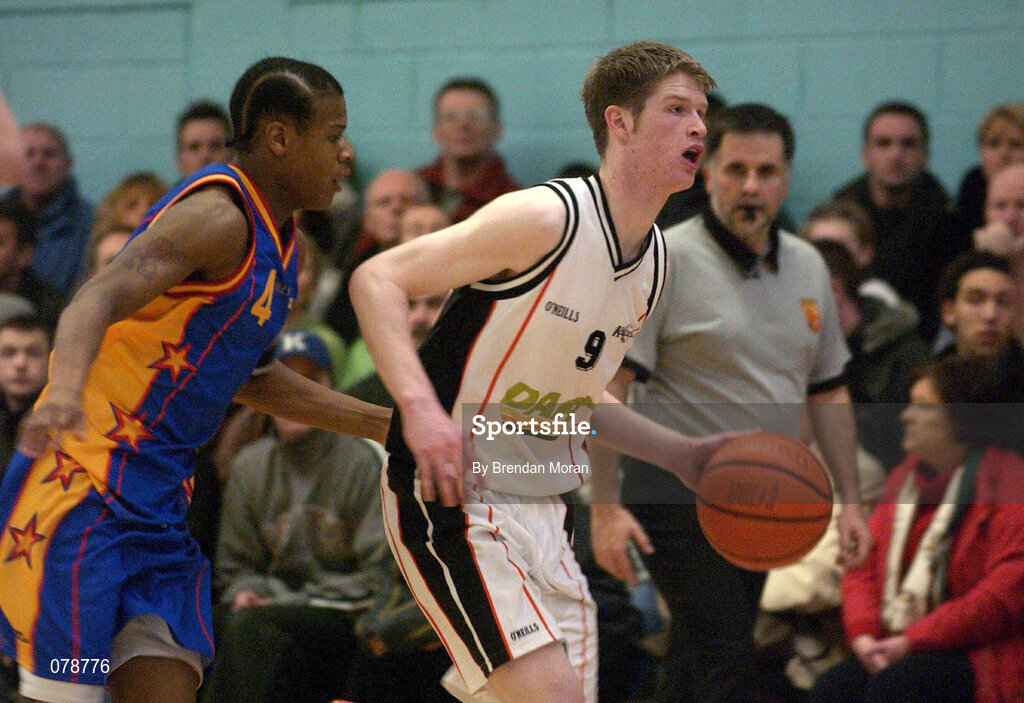 30 December 2001; Jonathan Grennell of Killester in action against  Corey Dickerson of  St Vincent's during the ESB Men's Superleague Basketball match between St Vincent's and Dart Killester at St Vincent's Basketball Club in Dublin. Photo by Brendan Moran/Sportsfile