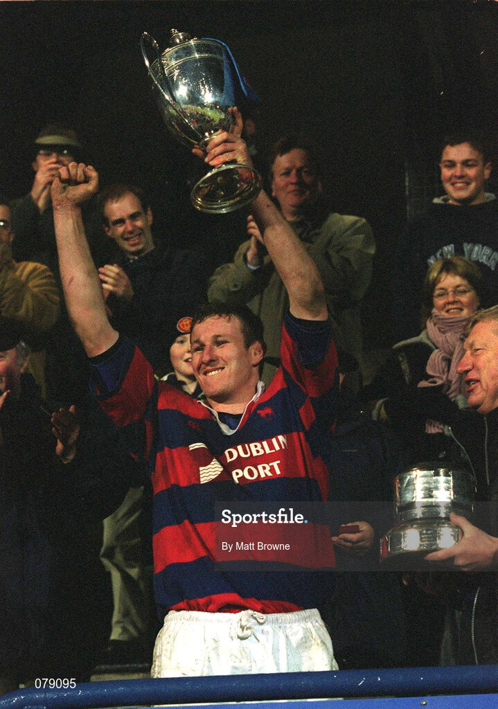 29 December 2001; Clontarf captain Donal Sheehan lifts the cup following the Leinster Senior Cup Final match between Clontarf and County Carlow at Donnybrook Stadium in Dublin. Photo by Matt Browne/Sportsfile