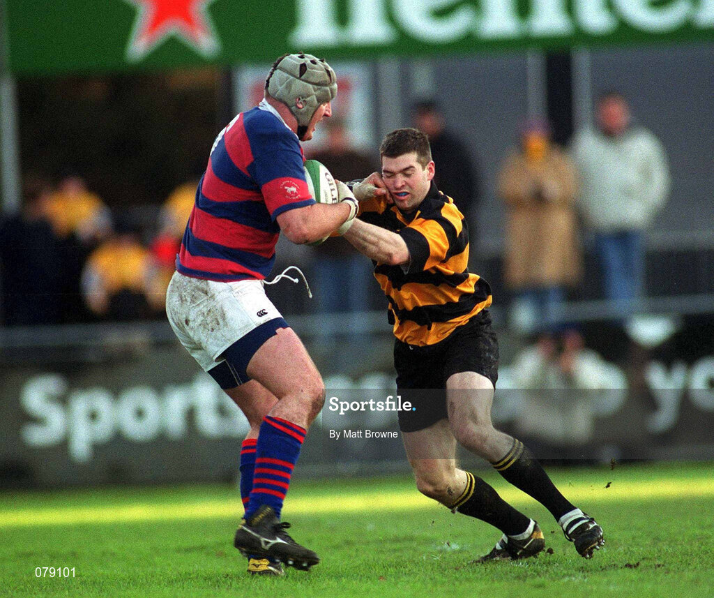 29 December 2001; Alan Dignam of Clontarf is tackled by Mark Buckley of County Carlow during the Leinster Senior Cup Final match between Clontarf and County Carlow at Donnybrook Stadium in Dublin. Photo by Matt Browne/Sportsfile