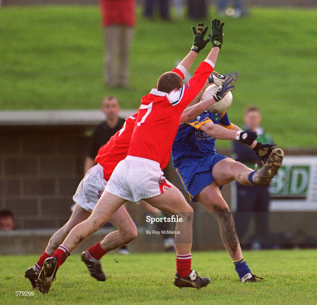 13 January 2002; Don Jackman of Wicklow in action against Louth's John Neary, centre, and Derek Shelvin of Louth during the O'Byrne Cup Semi-Final match between Louth and Wicklow at O'Raghallaighs GAA Club in Drogheda, Louth. Photo by Ray McManus/Sportsfile
