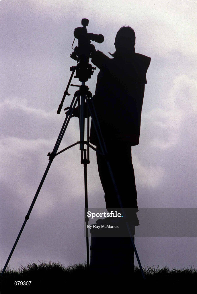 13 January 2002; A cameraman stands on a beer crate as he prepares to record the game prior to the O'Byrne Cup Semi-Final match between Louth and Wicklow at O'Raghallaighs GAA Club in Drogheda, Louth. Photo by Ray McManus/Sportsfile