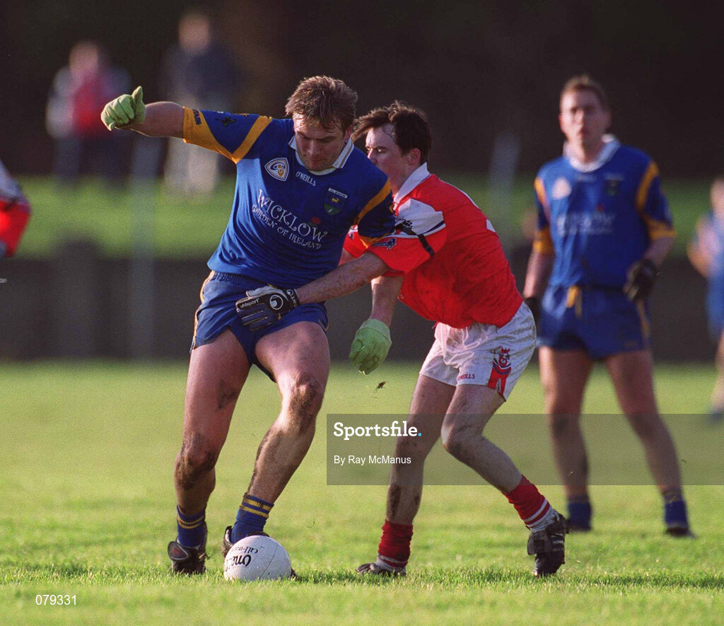 13 January 2001; Fergus Daly of Wicklow in action against Simon Gerard of Louth during the O'Byrne Cup Semi-Final match between Louth and Wicklow at O'Raghallaighs GAA Club in Drogheda, Louth. Photo by Ray McManus/Sportsfile