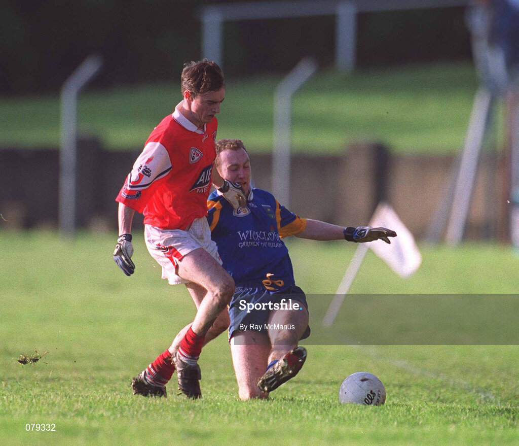 13 January 2001; Paddy Dalton of Wicklow in action against Simon Gerard of Louth during the O'Byrne Cup Semi-Final match between Louth and Wicklow at O'Raghallaighs GAA Club in Drogheda, Louth. Photo by Ray McManus/Sportsfile