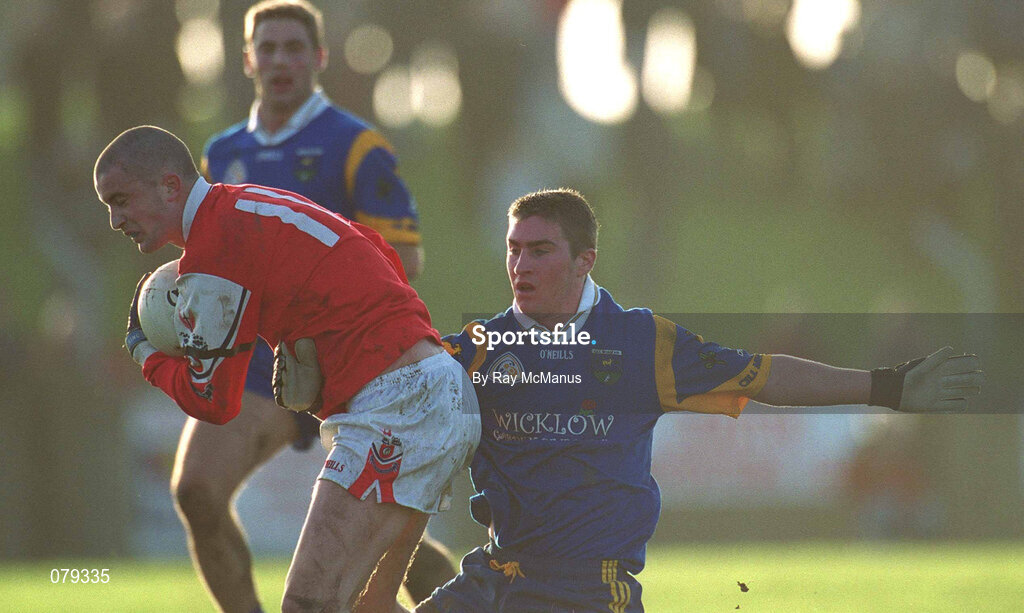 13 January 2002; Keith Lynch of Louth in action against Colm Tooney of Wicklow during the O'Byrne Cup Semi-Final match between Louth and Wicklow at O'Raghallaighs GAA Club in Drogheda, Louth. Photo by Ray McManus/Sportsfile