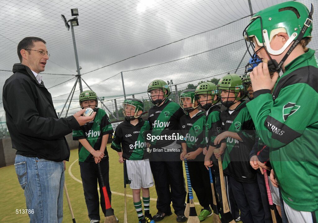10 May 2011; Dublin National Hurling League winner Liam Ryan marks the beginning of 'Camán Let’s Play', a hurling initiative organised by Parnell’s GAA Club to promote hurling and encourage participation among local Dublin schools. With over 220 children, ranging from 7yrs – 12yrs due to take part, the competition will be based on a round robin series of games, supported by eFlow and at no expense to the participating schools. Pictured at the launch is Liam Ryan with pupils from Scoil Fhursa, Kilmore West. Launch of 'Camán Let’s Play', supported by eFlow, Astro Park, Coolock, Dublin. Picture credit: Brian Lawless / SPORTSFILE