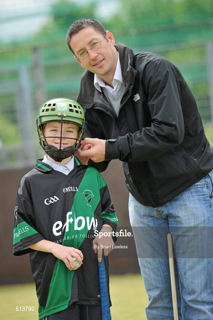 10 May 2011; Dublin National Hurling League winner Liam Ryan marks the beginning of 'Camán Let’s Play', a hurling initiative organised by Parnell’s GAA Club to promote hurling and encourage participation among local Dublin schools. With over 220 children, ranging from 7yrs – 12yrs due to take part, the competition will be based on a round robin series of games, supported by eFlow and at no expense to the participating schools. Pictured at the launch is Liam Ryan with pupil of Scoil Fhursa, Kilmore West, Adam Ives, age 9, from Coolock. Launch of 'Camán Let’s Play', supported by eFlow, Astro Park, Coolock, Dublin. Picture credit: Brian Lawless / SPORTSFILE