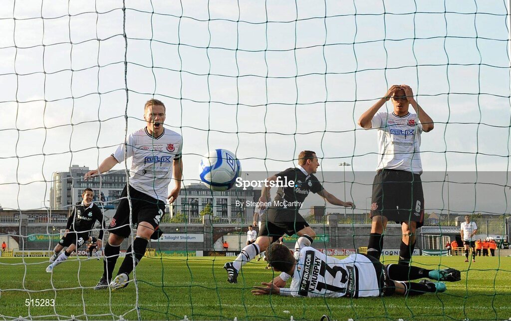 14 May 2011; Gary O'Neill, Shamrock Rovers, 19, turns to celebrate after scoring his side's first goal as Dundalk players, from left, Simon Madden, Nathan Murphy and Michael Hector look on. Setanta Sports Cup Final, Dundalk v Shamrock Rovers, Tallaght Stadium, Tallaght, Co. Dublin. Picture credit: Stephen McCarthy / SPORTSFILE