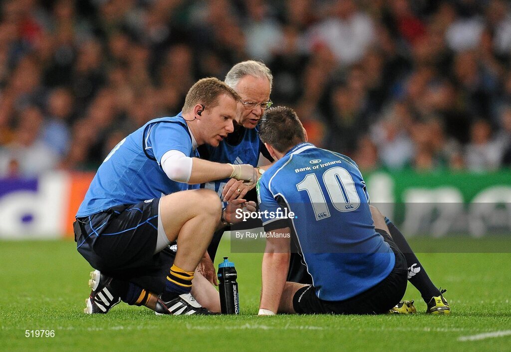 21 May 2011; Jonathan Sexton, Leinster, is attended to by Leinster team doctor Prof Arthur Tanner, right, and physiotherapist James Allen. Heineken Cup Final, Leinster v Northampton Saints, Millennium Stadium, Cardiff, Wales. Picture credit: Ray McManus / SPORTSFILE