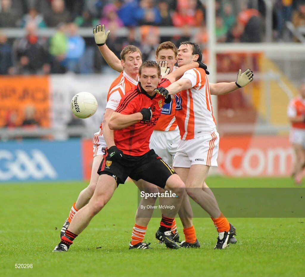 28 May 2011; Peter Fitzpatrick, Down, in action against left to right, Kieran Toner, Tony Kernan and Charlie Vernon, Armagh. Ulster GAA Football Senior Championship Quarter-Final, Armagh v Down, Morgan Athletic Grounds, Armagh. Picture credit: Oliver McVeigh / SPORTSFILE