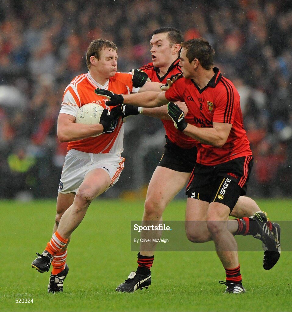 28 May 2011; Kieran Toner, Armagh, in action against Kalum King, left, and Peter Fitzpatrick, Down. Ulster GAA Football Senior Championship Quarter-Final, Armagh v Down, Morgan Athletic Grounds, Armagh. Picture credit: Oliver McVeigh / SPORTSFILE
