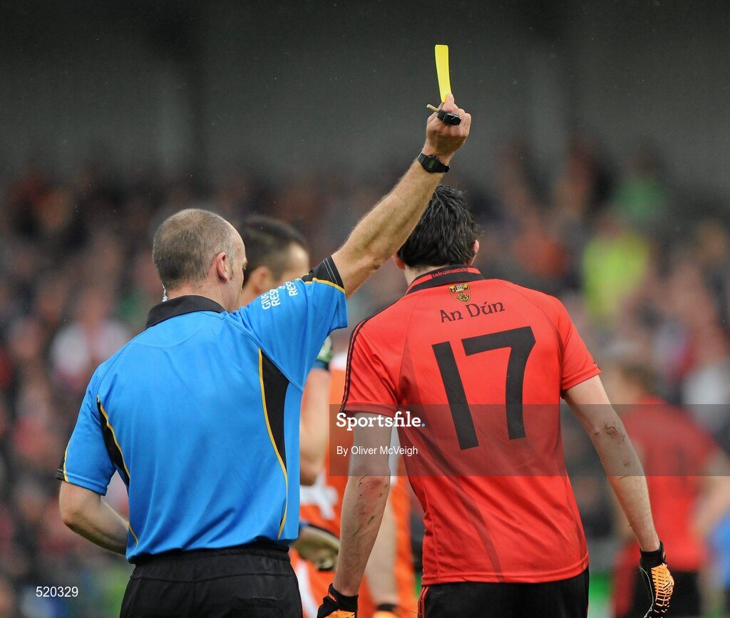 28 May 2011; Gerard McCartan, Down, is shown a yellow card by referee Cormac Reilly during the first half. Ulster GAA Football Senior Championship Quarter-Final, Armagh v Down, Morgan Athletic Grounds, Armagh. Picture credit: Oliver McVeigh / SPORTSFILE