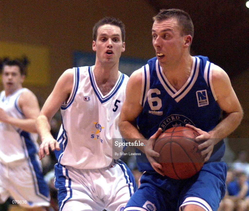 25 January 2002; Dean Kavanagh of Waterford Crystal in action against Adrian Fulton of SX3 Star during the ESB Men's National Cup semi-final between Waterford Crystal and SX3 Star at the ESB Arena in Tallaght, Dublin. Photo by Brian Lawless/Sportsfile