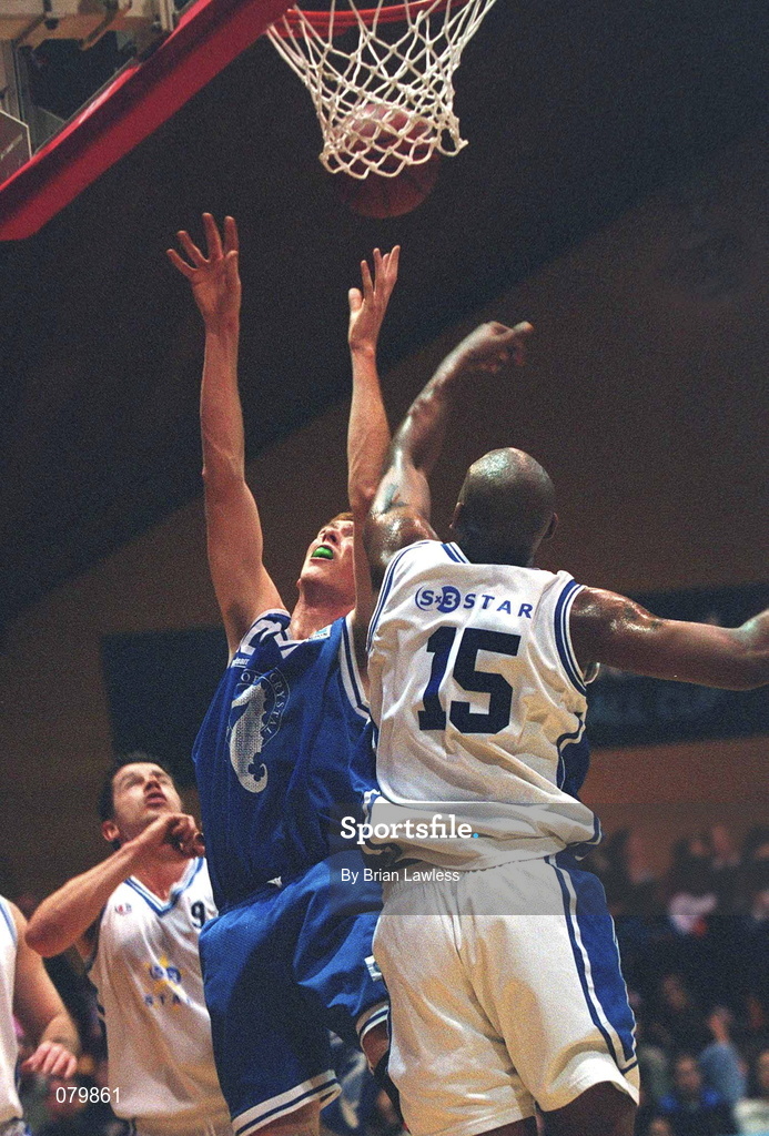 25 January 2002; Joe Malone of Waterford Crystal goes up for a basket despite the attentions of Marvin Dixon of SX3 Star during the ESB Men's National Cup semi-final between Waterford Crystal and SX3 Star at the ESB Arena in Tallaght, Dublin. Photo by Brian Lawless/Sportsfile