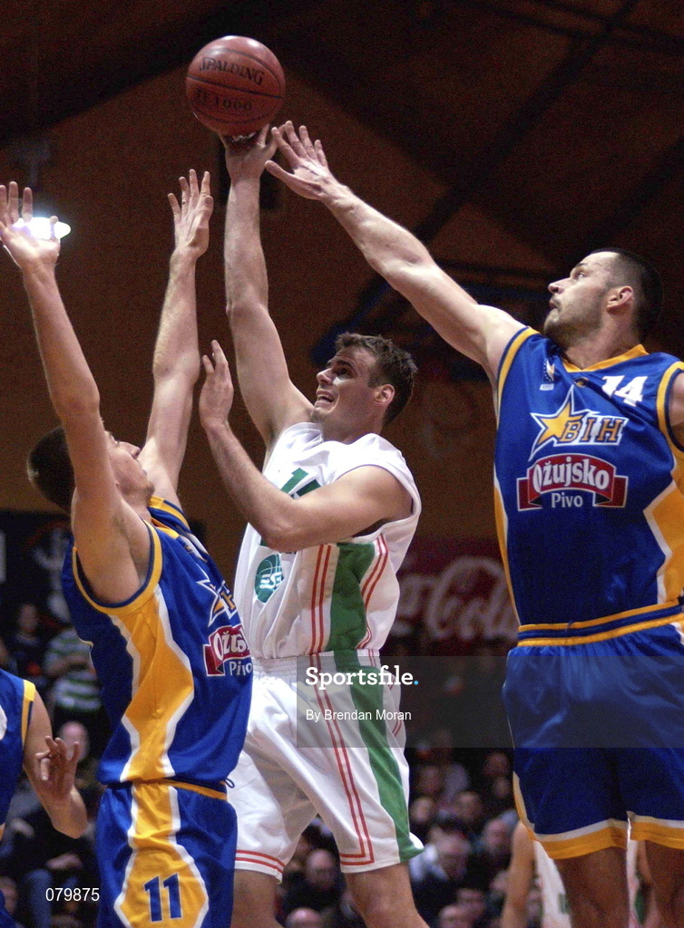 26 January 2002; Glenn Sekunda of Ireland shoots for a basket despite the attentoions of Bosnia's Domagoj Pinjuh, left, and Elvir Ovcina, 14, during the European Championship semi-final match between Ireland and Bosnia at the ESB Arena in Tallaght, Dublin. Photo by Brendan Moran/Sportsfile