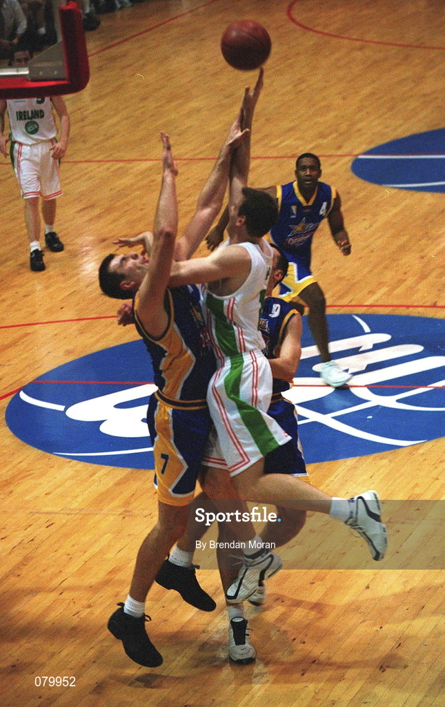 26 January 2002; Glenn Sekunda of Ireland shoots for a basket despite the attentions of Samir Leric of Bosnia during the European Championship semi-final match between Ireland and Bosnia at the ESB Arena in Tallaght, Dublin. Photo by Brendan Moran/Sportsfile