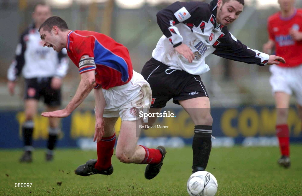 27 January 2002; Chris Lawless of Dundalk in action against Owen Heary of Shelbourne during the eircom League Premier Division match between Dundalk and Shelbourne at Oriel Park in Dundalk. Photo by David Maher/Sportsfile