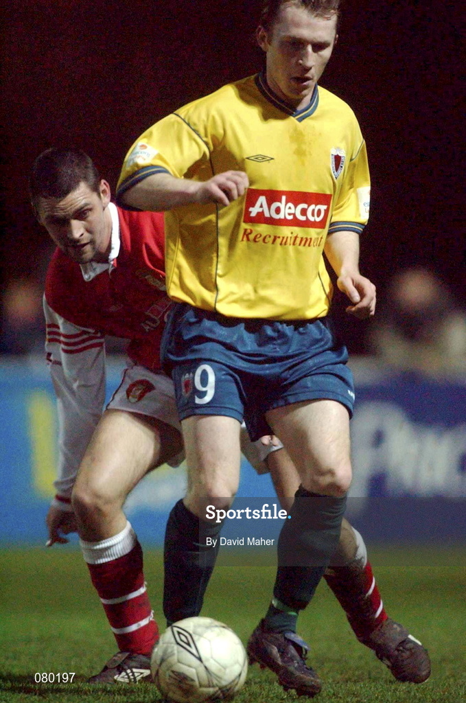 29 January 2002; Trevor Molloy of Bohemians in action against Darragh Maguire of St Patrick's Athletic during the Eircom League Cup quarter final match between St Patrick's Athletic and Bohemians at Richmond Park in Dublin. Photo by David Maher/Sportsfile