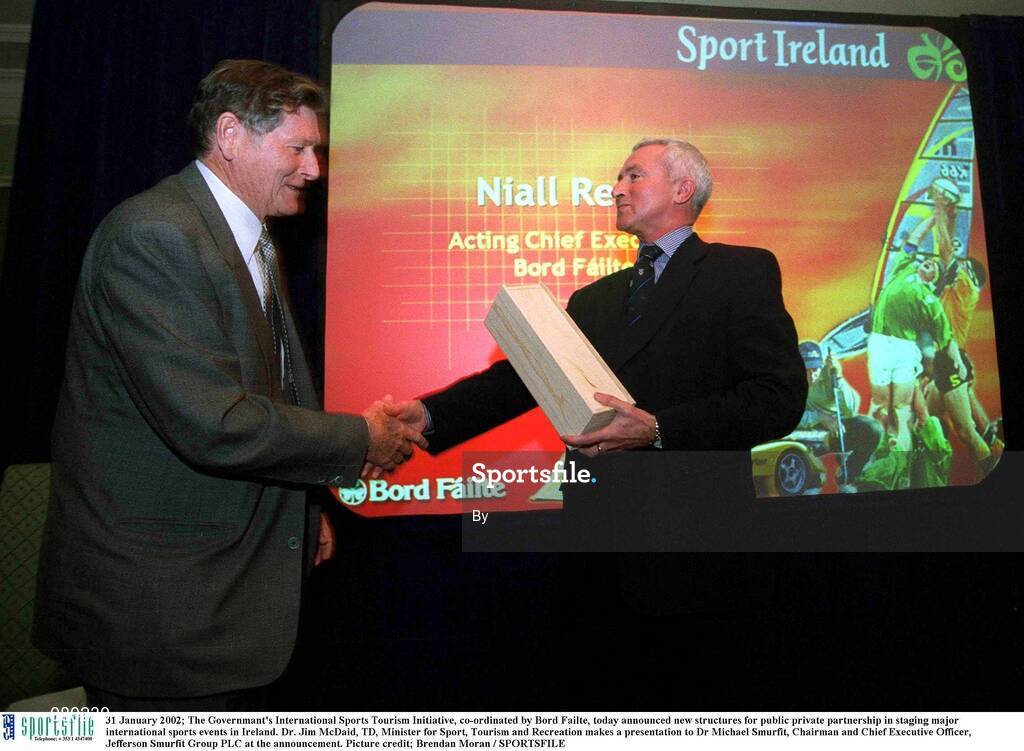 31 January 2002; The Governmant's International Sports Tourism Initiative, co-ordinated by Bord Failte, today announced new structures for public private partnership in staging major international sports events in Ireland. Dr. Jim McDaid, TD, Minister for Sport, Tourism and Recreation makes a presentation to Dr Michael Smurfit, Chairman and Chief Executive Officer, Jefferson Smurfit Group PLC at the announcement. Picture credit; Brendan Moran / SPORTSFILE