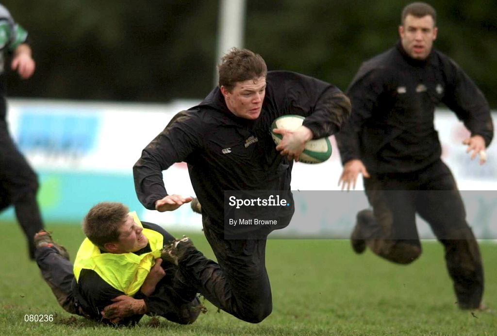 30 January 2002; Brian O'Driscoll is tackled by Ronan O'Gara during Irish Rugby Squad Training at Dr Hickey Park in Greystones, Wicklow. Photo by Matt Browne/Sportsfile