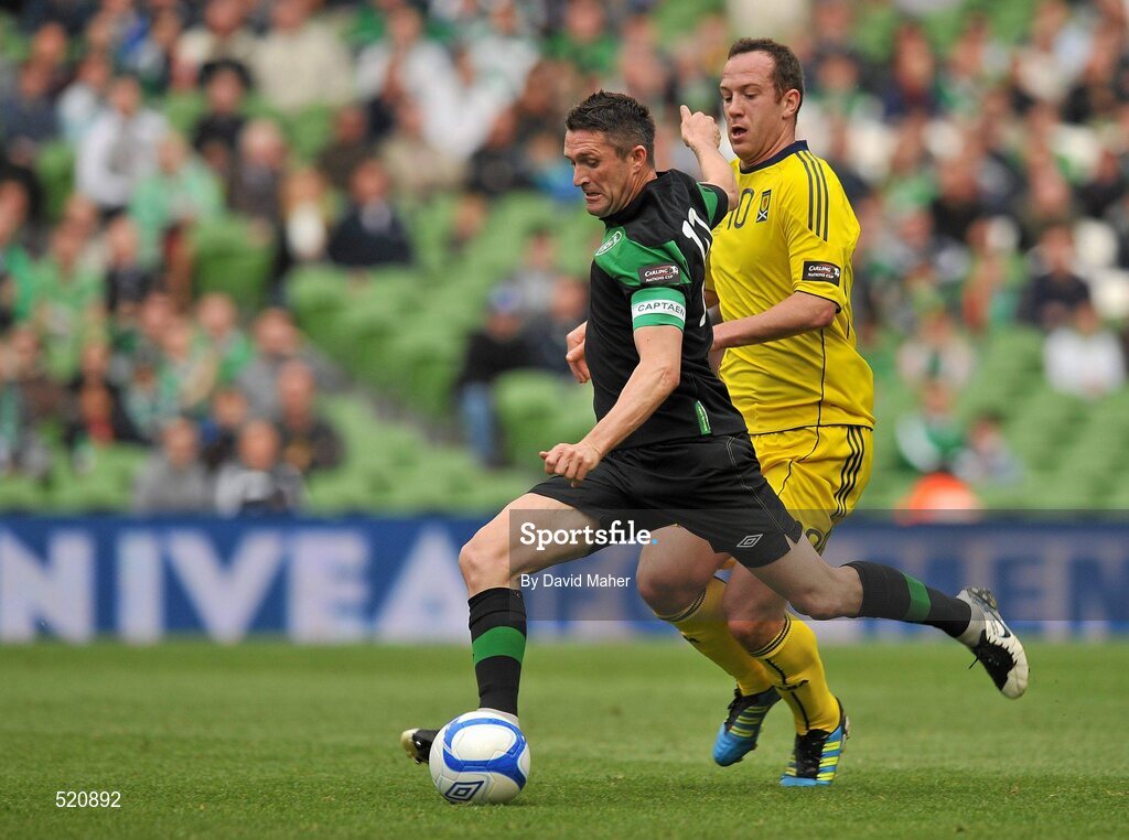 29 May 2011; Robbie Keane, Republic of Ireland, shoots to score his side's first goal, despite the attentions of Charlie Adam, Scotland. The goal was also his 49th international goal which puts him level with Sir Bobby Charlton for most International goals scored. Carling Four Nations Tournament, Republic of Ireland v Scotland, Aviva Stadium, Lansdowne Road, Dublin. Picture credit: David Maher / SPORTSFILE