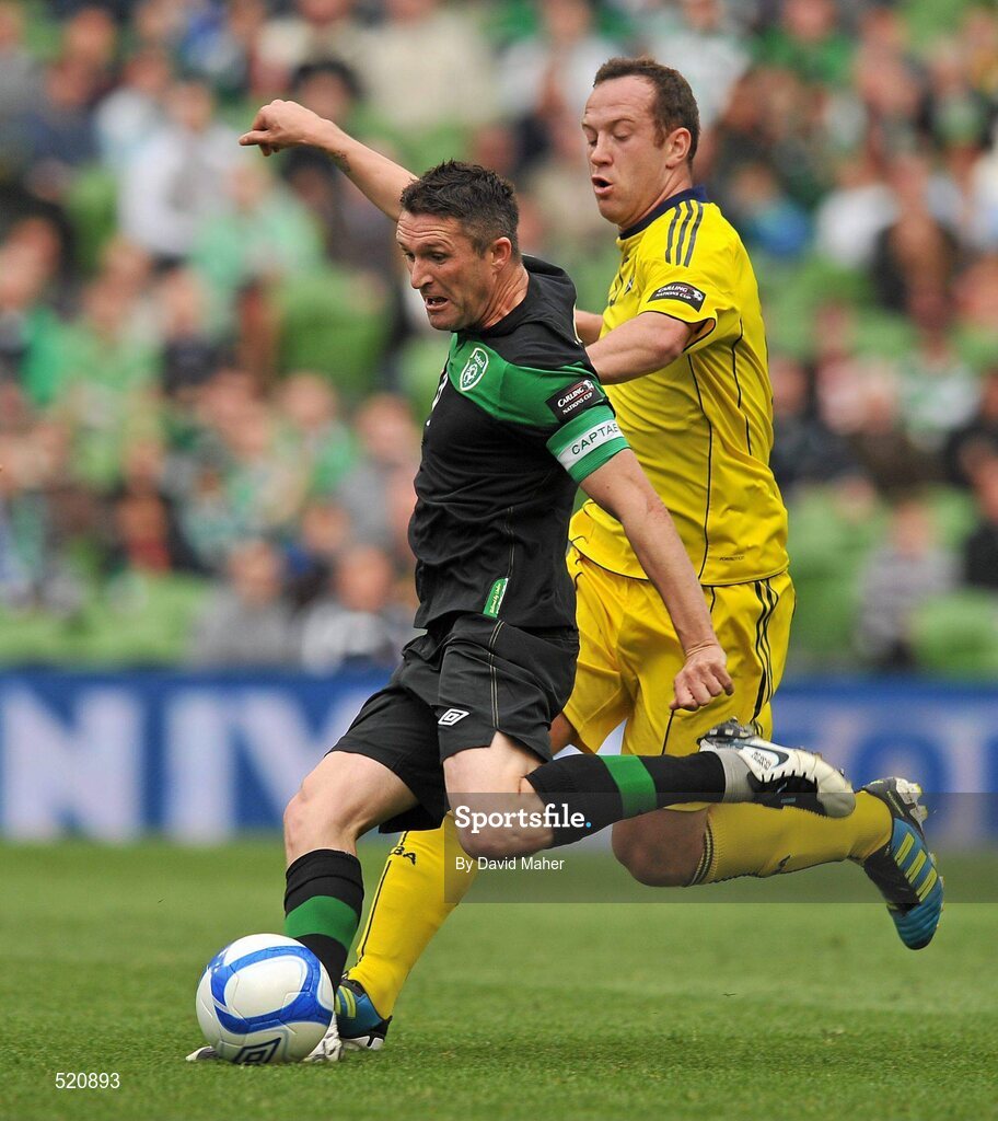 29 May 2011; Robbie Keane, Republic of Ireland, shoots to score his side's first goal, despite the attentions of Charlie Adam, Scotland. The goal was also his 49th international goal which puts him level with Sir Bobby Charlton for most International goals scored. Carling Four Nations Tournament, Republic of Ireland v Scotland, Aviva Stadium, Lansdowne Road, Dublin. Picture credit: David Maher / SPORTSFILE