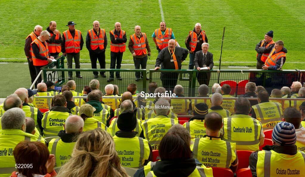 28 May 2011; Field stewards, in yellow, and their supervisors listen to the Ulster Chief Steward Brendan Kirk, suit, and Event Controller Brian Smyth, orange tie, before patrons arrived for the game. Ulster GAA Football Senior Championship Quarter-Final, Armagh v Down, Morgan Athletic Grounds, Armagh. Picture credit: Ray McManus / SPORTSFILE