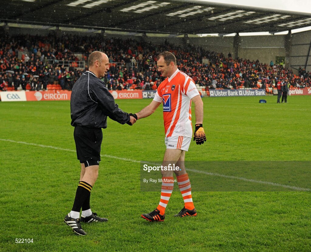 28 May 2011; The Armagh captain Steven McDonnell greets referee Cormac Reilly before the game. Ulster GAA Football Senior Championship Quarter-Final, Armagh v Down, Morgan Athletic Grounds, Armagh. Picture credit: Ray McManus / SPORTSFILE