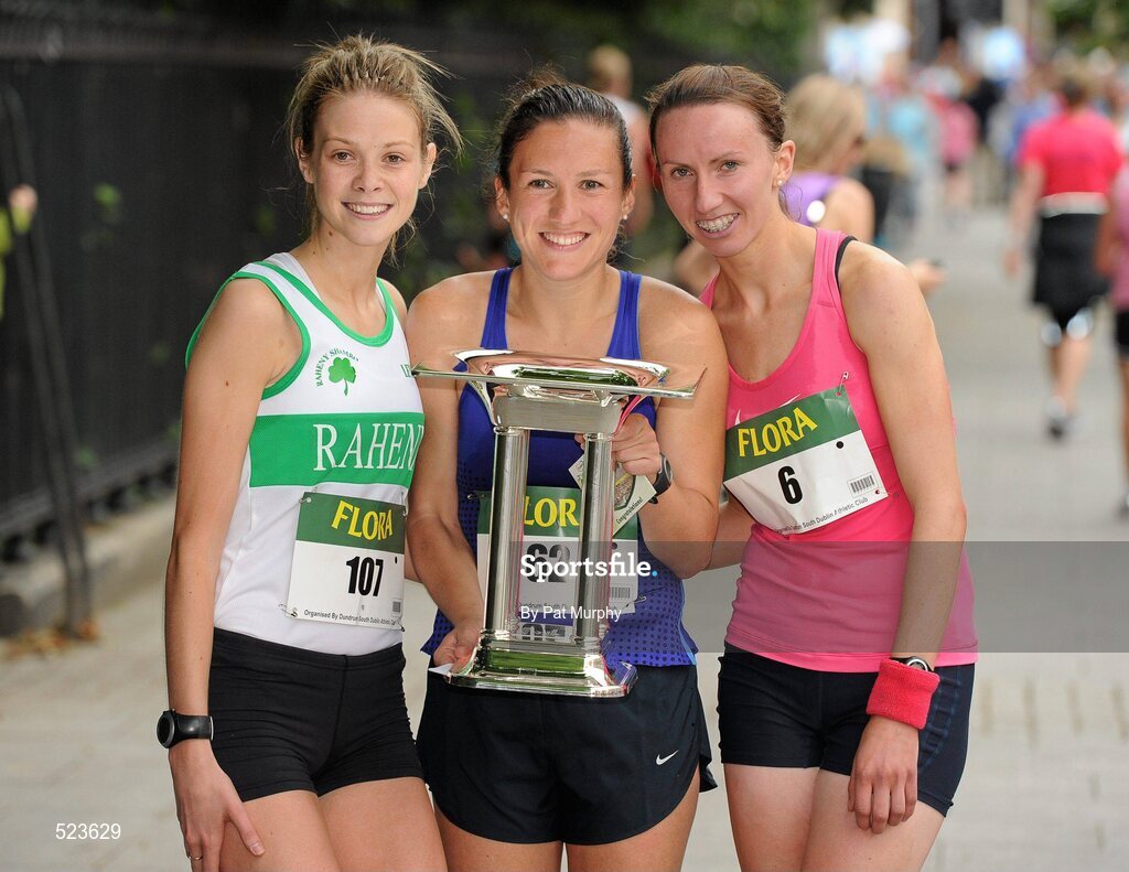 6 June 2011; Donegal's Catriona Jennings with the trophy after winning the 2011 Flora Womens Mini Marathon alongside second placed Siobhan O'Doherty, Nenagh, Co. Tipperary, right, and third placed Aoife Talty, Dublin, left. 2011 Flora Womens Mini Marathon, Dublin City. Picture credit: Pat Murphy / SPORTSFILE