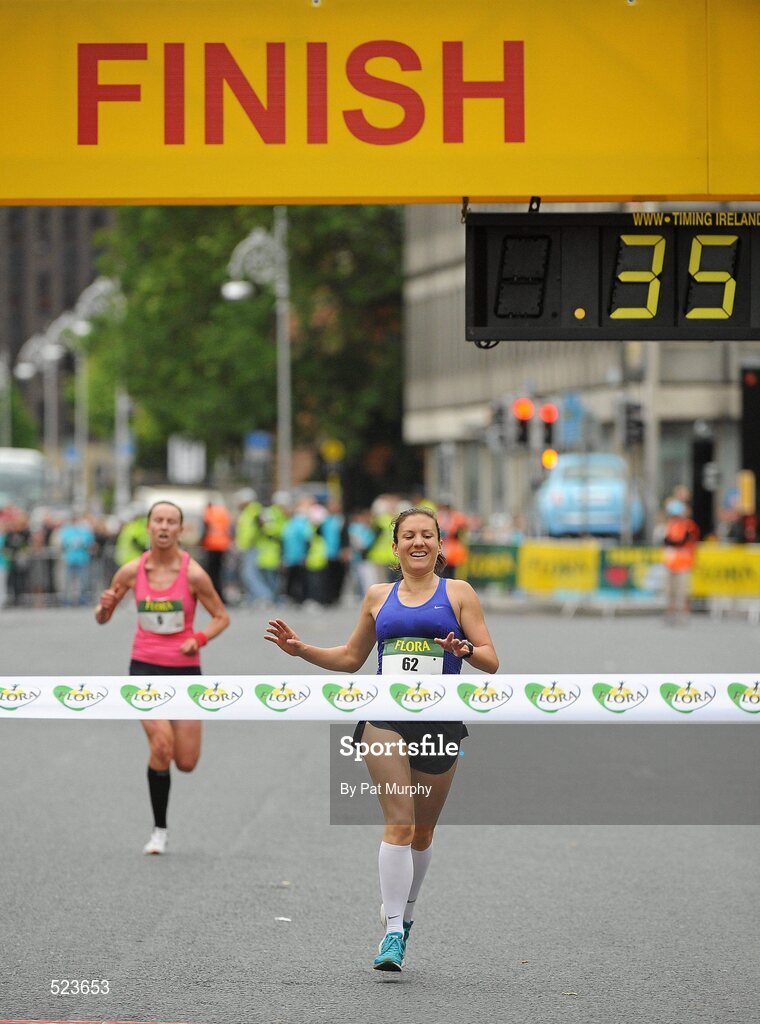 6 June 2011; Donegal's Catriona Jennings crosses the finish line to win the 2011 Flora Womens Mini Marathon ahead of second placed Siobhan O'Doherty, Nenagh, Co. Tipperary, left. 2011 Flora Womens Mini Marathon, Dublin City. Picture credit: Pat Murphy / SPORTSFILE