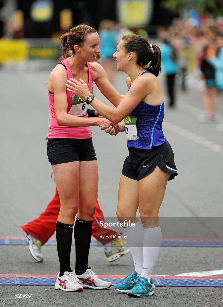 6 June 2011; Donegal's Catriona Jennings is congratulated by second placed Siobhan O'Doherty, Nenagh, Co. Tipperary, left, after winning the 2011 Flora Womens Mini Marathon. 2011 Flora Womens Mini Marathon, Dublin City. Picture credit: Pat Murphy / SPORTSFILE