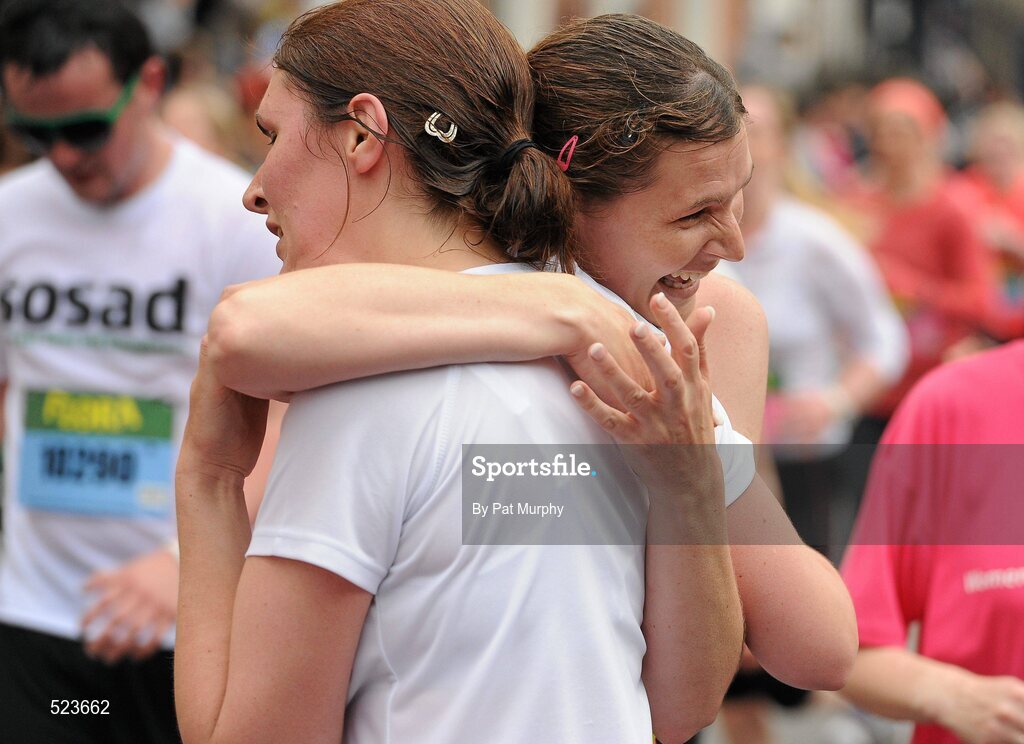 6 June 2011; Competitors celebrate after finishing the 2011 Flora Womens Mini Marathon. 2011 Flora Womens Mini Marathon, Dublin City. Picture credit: Pat Murphy / SPORTSFILE